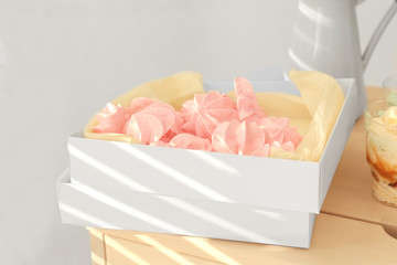 Delicious meringue cookies in white box