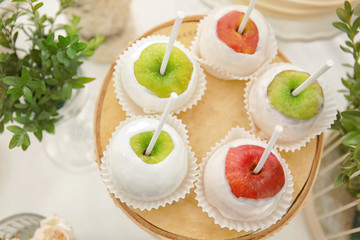 Glazed apples in candy bar with forest style decorations