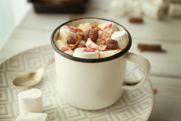 Composition with tasty cocoa and marshmallow on table, closeup