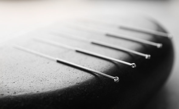 Stone And Needles For Acupuncture, Closeup