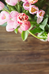 Pink tulips on the wooden background. Pink tulip. Tulips. Flowers. Flower background. Flowers photo concept. Colored tulips. Petals. Narcissus