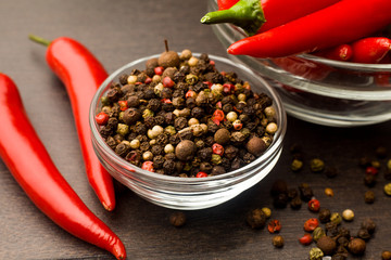 bunch fresh raw red hot chilli pepper and bell pepper on a wooden background