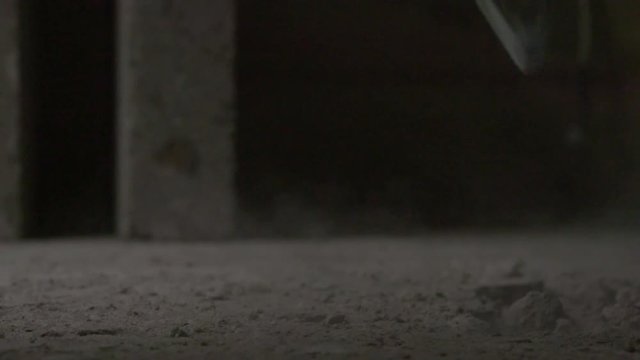 SLOW MOTION VIDEO FOOTAGE: Sledgehammer destructs a floor tile