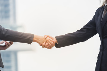 Co-Business and Co-worker partners Successful businessman shaking hands Concept