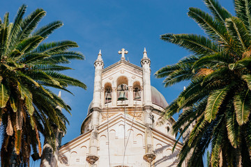Fototapeta na wymiar Belfry of a church in Montenegro, against the sky.