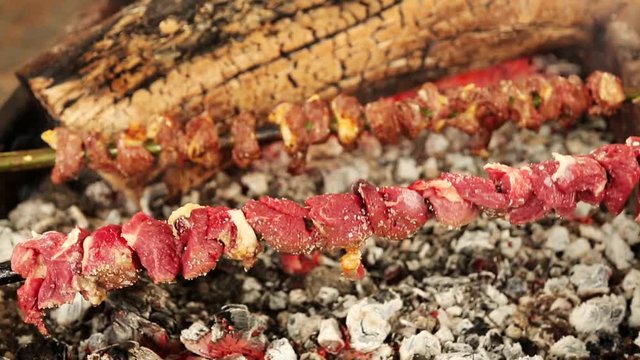 of a meat skewer barbeque with fire. So called Espetada on Madeira island