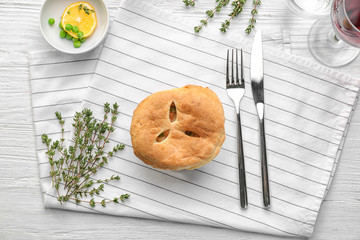 Tasty chicken pot pie on napkin