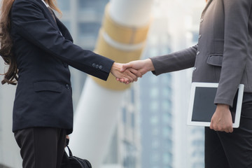 Co-Business and Co-worker partners Successful businessman shaking hands Concept