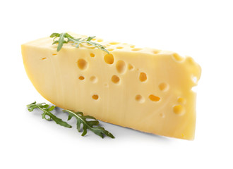 Piece of tasty cheese and arugula on white background