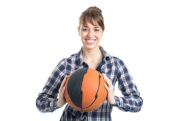 Happy attractive young woman holding a basketball isolated on white background.