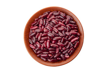 Ceramic bowl of raw red beans on white