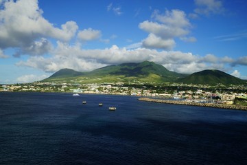 Saint Kitts Island landscape -  view from water on a brignt sunny day with some white clouds