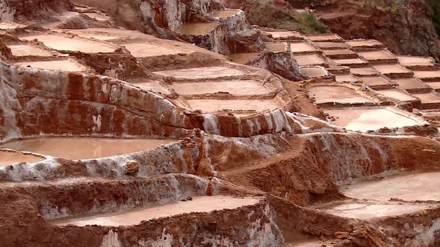  well known Maras salt evaporation pond in the Andes of Peru in the Region of Cusco (Cuzco). South America