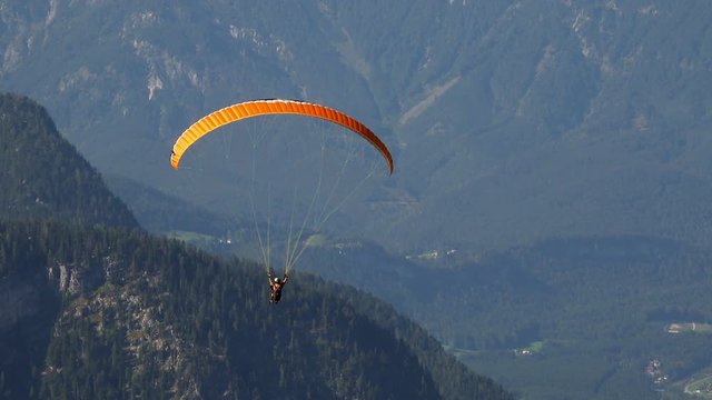 Skydiver or Paraglider over Austrian Alps Mountains. 4K 