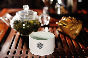 White tea bowl on the background of a tea table close-up. tea ceremony