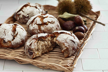 Black dried bread with nutshell on tray