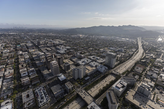 Aerial view of downtown Glendale California and the Ventura 134 freeway with Los Angeles towers in background.