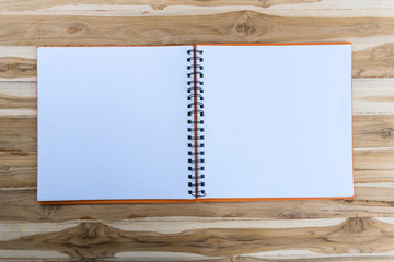 open book with blank pages on wood table