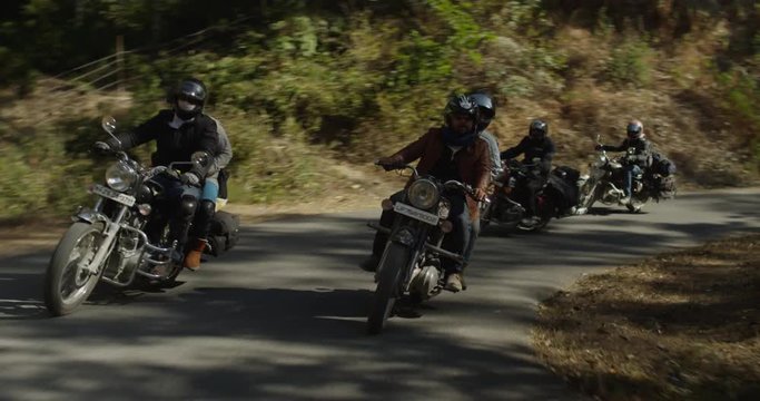 Motorcyclists riding up hills in nothern India, Kumaon region