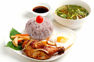 Vietnamese lunch set of rice with fried chicken legs