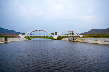 Fototapeta na wymiar Tha Chomphu Railway Bridge in Lamphun Province Northern Thailand. It's a famous landmark in Lamphun Province.