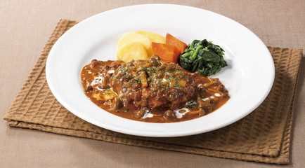 Fried beef soup with potatoes on white platter