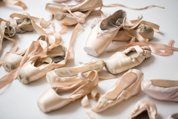 Many pairs of ballet shoes