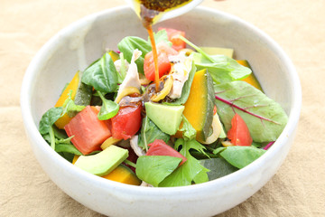 Special salad mixed with avocado, tomatoes and spinach
