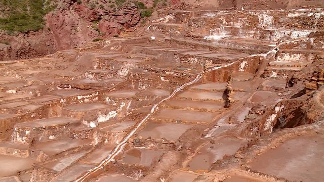 SALT MINING: video footage from Maras, Peru. Region of Cusco in andean landscape in South America, Peru.