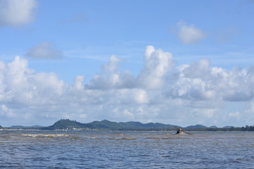 A man is fishing in the Gulf of Thailand