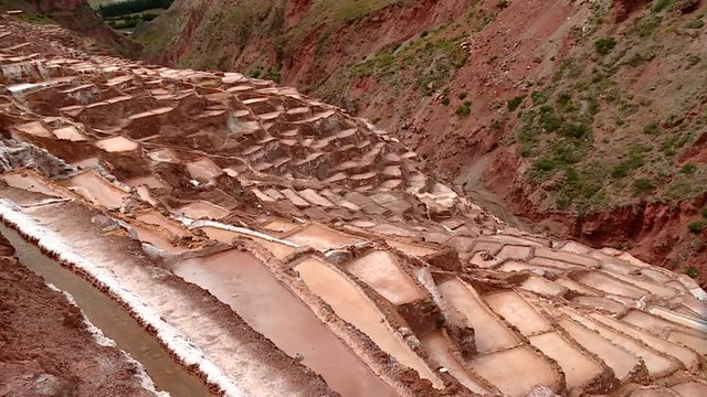 SALT MINING: video footage from Maras, Peru. Region of Cusco in andean landscape in South America, Peru.