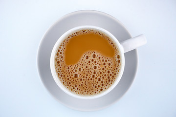 Teh Tarik (Hot Milk Tea) on white background.