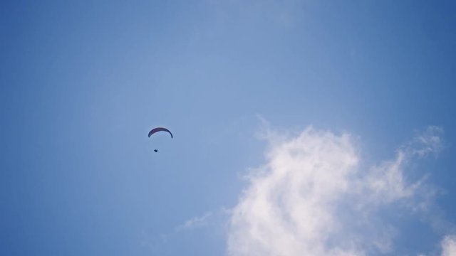 sports hang glider flying overhead up high