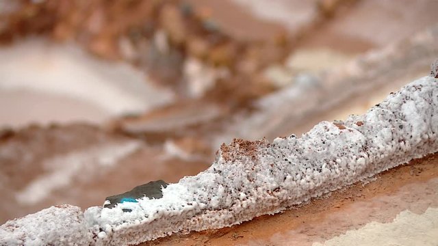 SALT MINING: video footage from Maras, Peru. Region of Cusco in andean landscape in South America, Peru.
