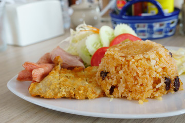 American fried rice , Fried rice with Chicken , sausage , ham and egg. Delicious food in Thailand