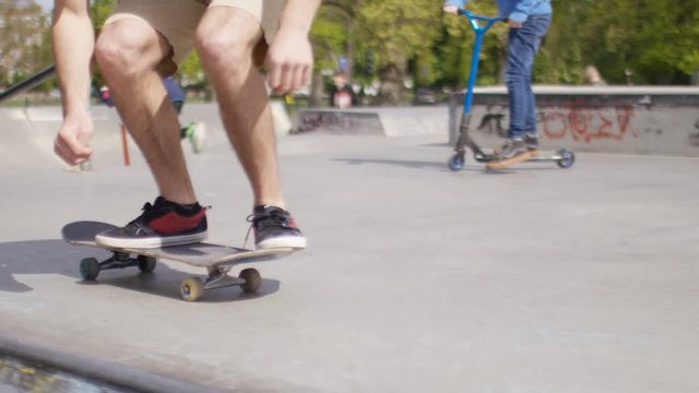 Skateboarder performing a kick flip, in slow motion