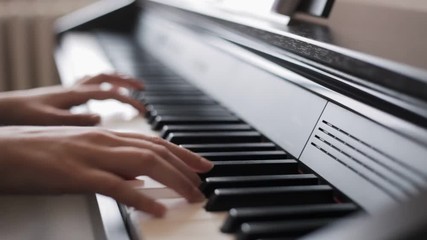 Hands playing piano - Powered by Adobe