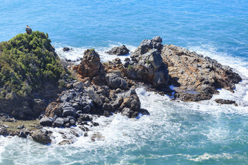 Fototapeta na wymiar Rocks in sea washed by waves
