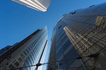 Foto op Canvas Reflections Corporate office buildings against blue sky in the city of Sydney. Copyspace. © David