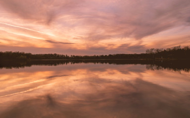Naklejka na ściany i meble Sunset on a lake