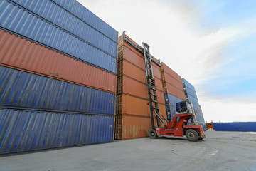 containers stacking in yard lifting by forklift stacker in charge