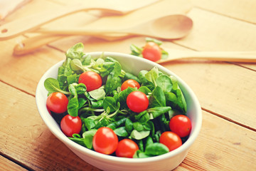 Portion of cherry tomatoes and basil salad.