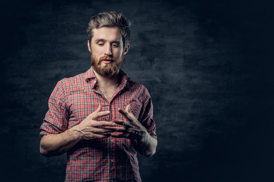 A Positive Bearded Male Dressed In A Red Fleece Shirt Tells A Story With Hand Movement.