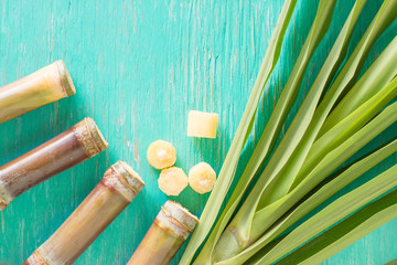 Close up sugarcane,Sugar cane on wood background.Close up Sugar cane on wood background.