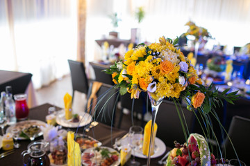 Beautiful flowers on table in wedding day. yellow flowers and color