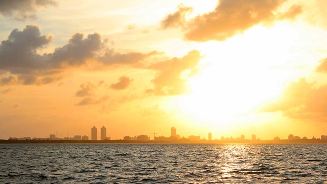 Cloudy Sunset Over the City Skyline