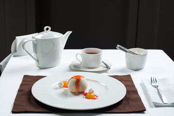 ice cream beautifully decorated on a white plate