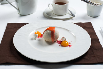 ice cream beautifully decorated on a white plate