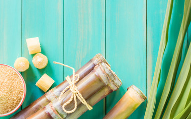 Fototapeta na wymiar Close up sugarcane,Sugar cane on wood background.Close up Sugar cane on wood background.