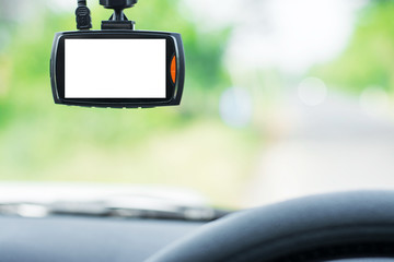 Close up car on highway at sunset, with video recorder next to a rear view mirror,video recorder...